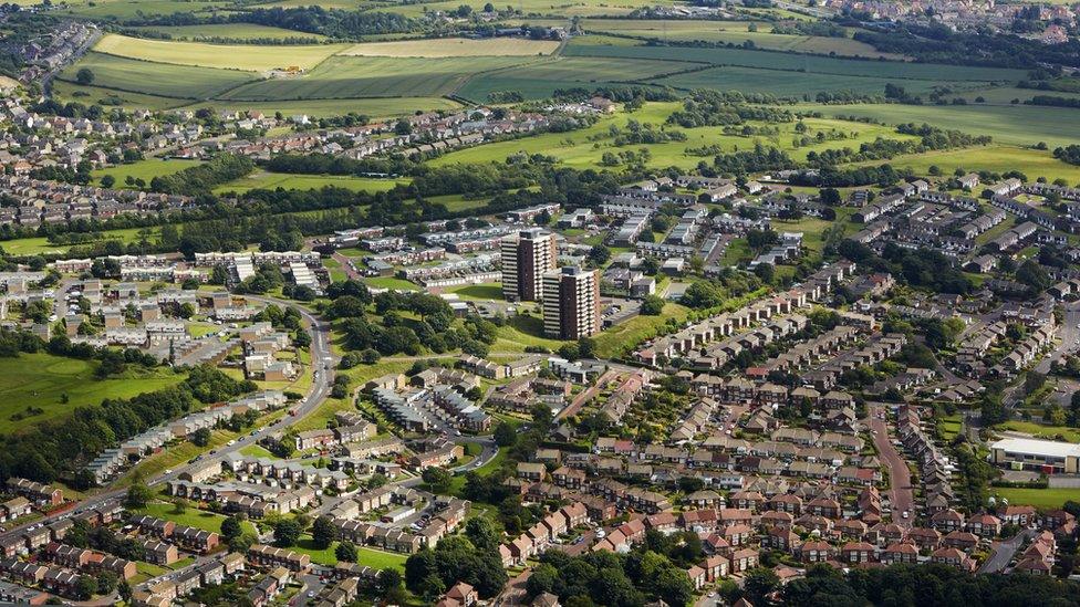 Aerial views of houses and flat blocks