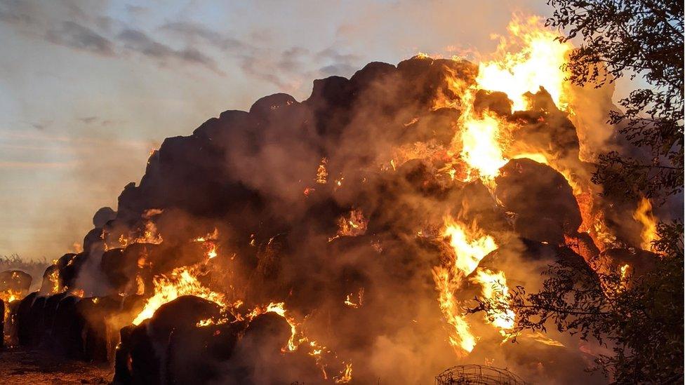 Hay bales on fire