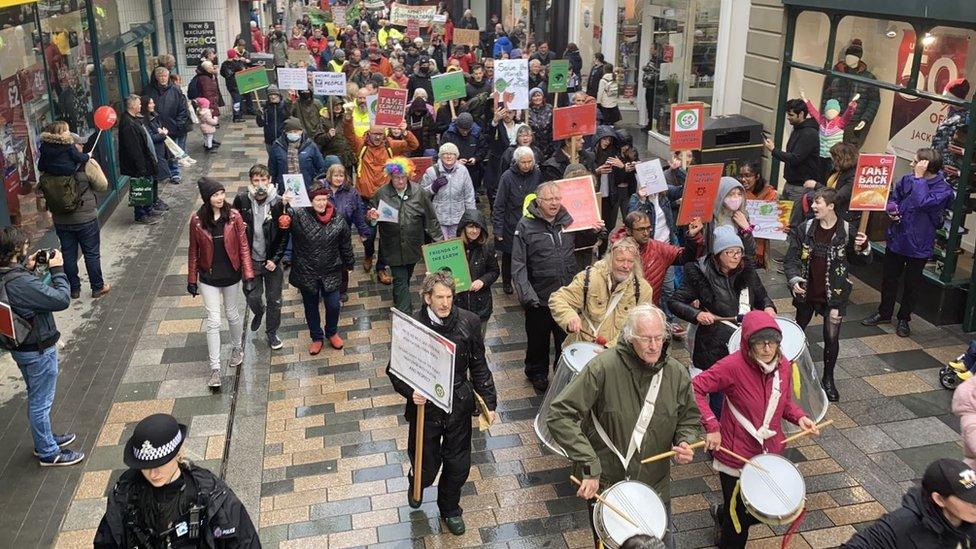 Protestors marching through Douglas town centre