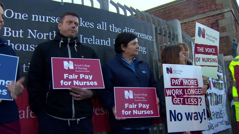 Members of the Royal College of Nursing outside the Royal Victoria Hospital on Tuesday