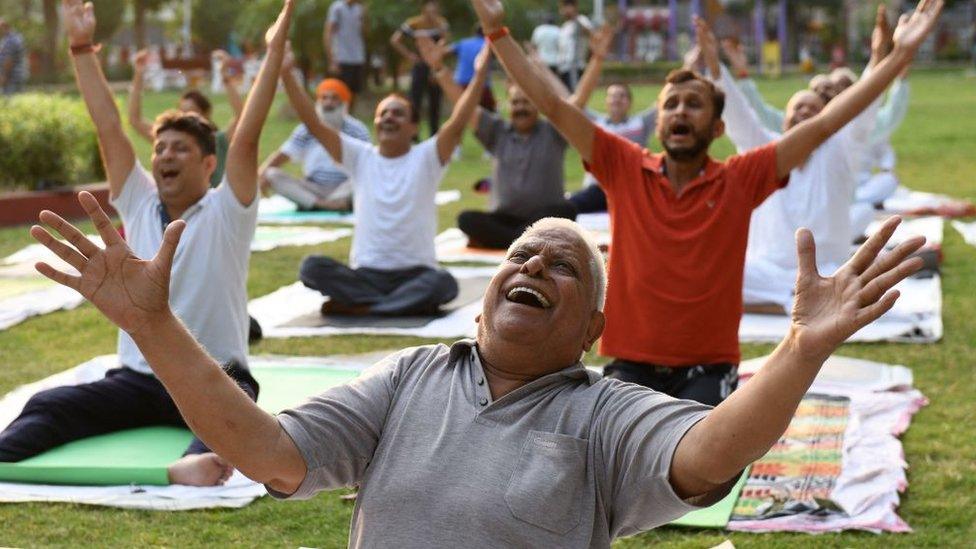 Yoga practitioners exercise ahead of the International Yoga day at a park in Amritsar on June 19, 2021.