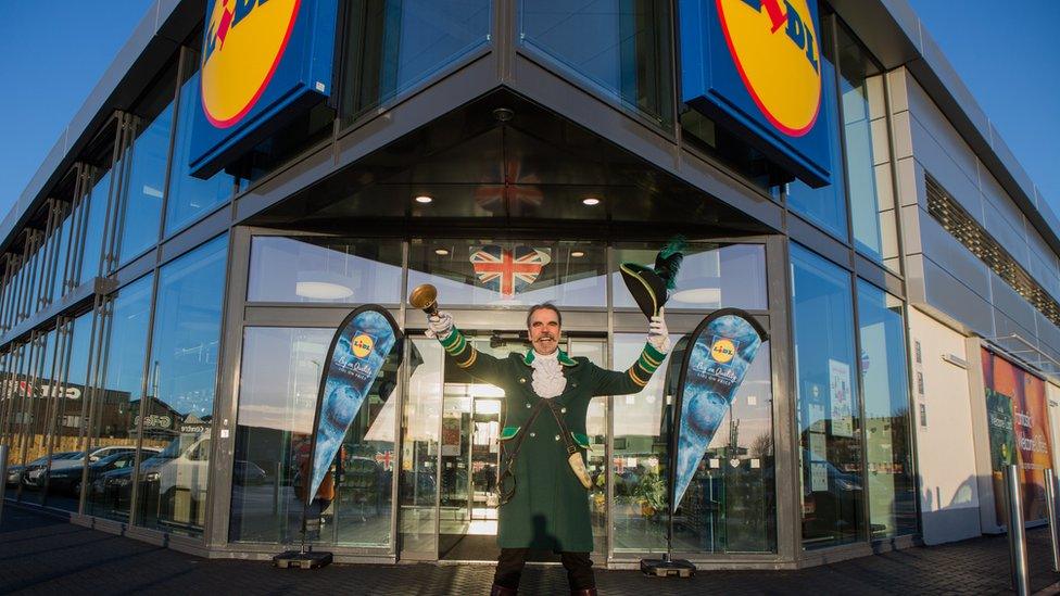 Town crier and Lidl store