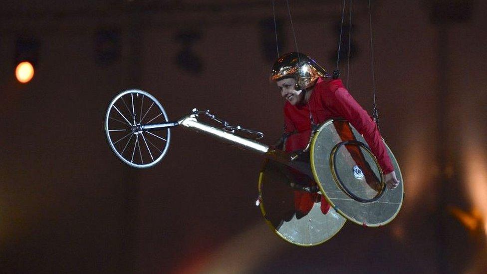 Former Paralympic athlete, Tanni Grey-Thompson, is lifted into the air in the Olympic Stadium during the opening ceremony of the London 2012 Paralympic Games