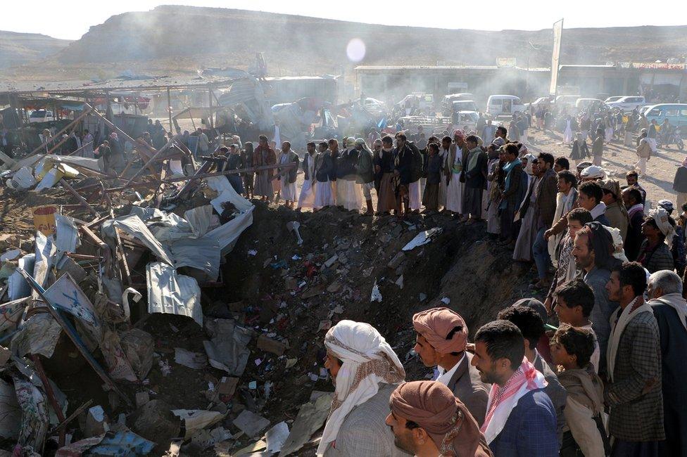 People gather at the site of a suspected Saudi-led coalition air strike in Sahar district, Saada province, Yemen (1 November 2017)