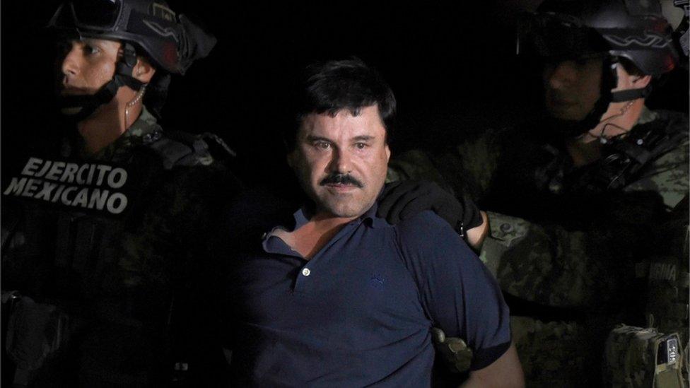 Drug kingpin Joaquin "El Chapo" Guzman is escorted into a helicopter at Mexico City"s airport following his recapture during an intense military operation in Los Mochis, in Sinaloa State