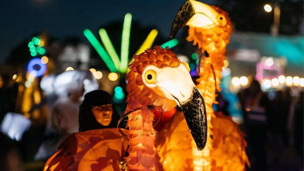 A giant, illuminated bird