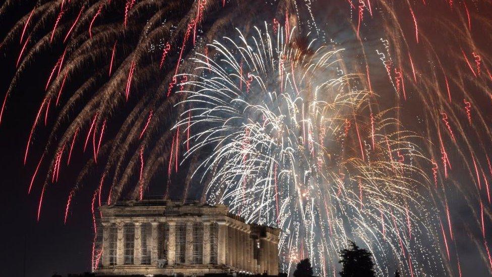 Fireworks explode over the ancient Parthenon temple atop the Acropolis hill during New Year's Day celebrations, in Athens, Greece