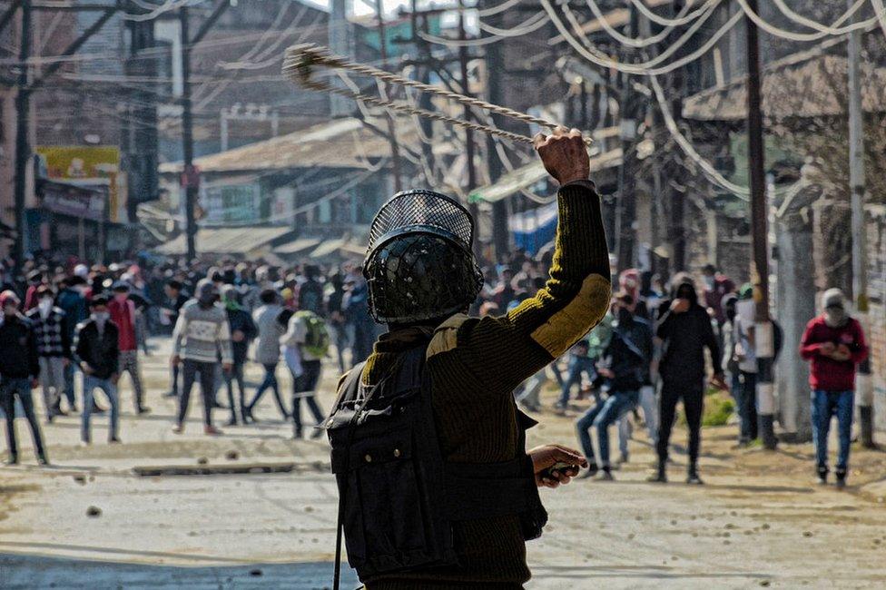 Kashmiri women journalists hold placards as they protest against the continued communication blockade by the Indian authorities after the revocation of special status of Kashmir on October 03 , 2019 in Srinagar,