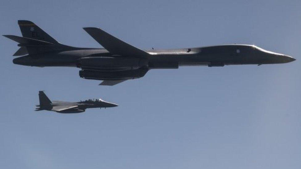 A US Air Force B-1B Lancer, flanked by Republic of Korea Air Force fighter, taking part in a show of force exercise in response to North Korean ballistic missile tests (18 September 2017)