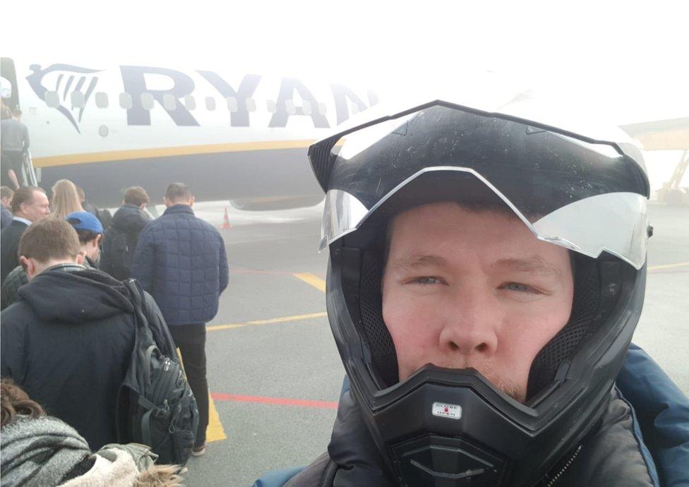 Martin wearing his helmet as he boarded the Ryanair plane