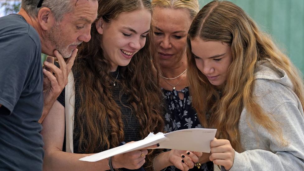 Students looking at results