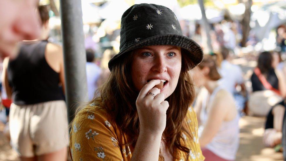 Elly tries a laksa chocolate