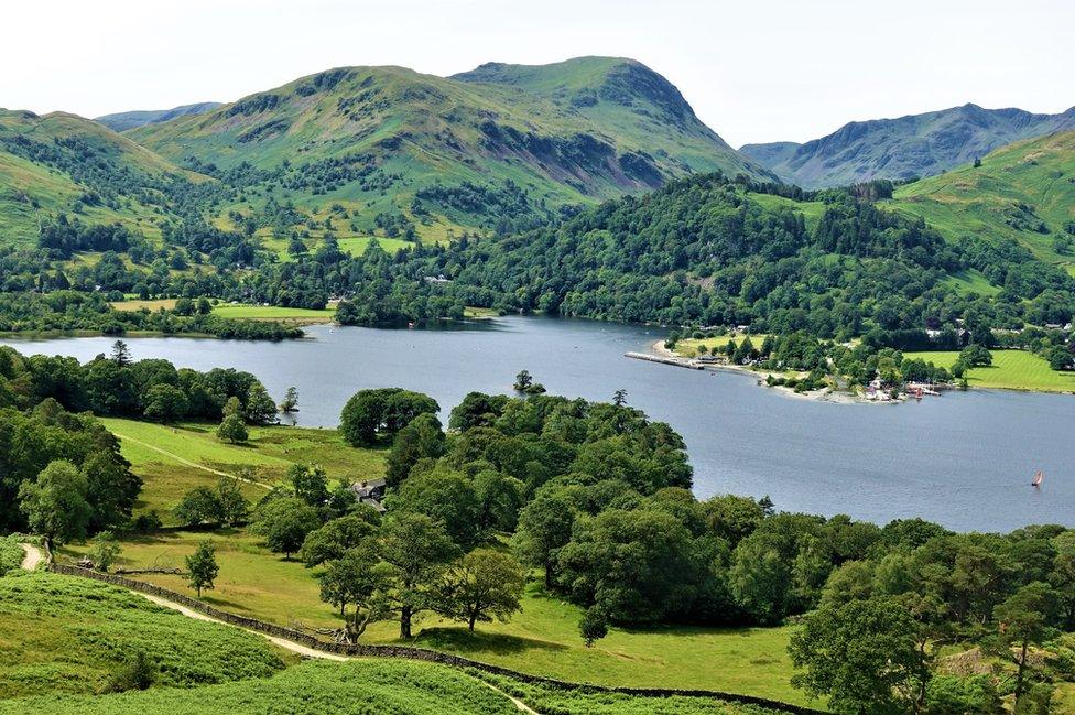 Hills and trees by a lake