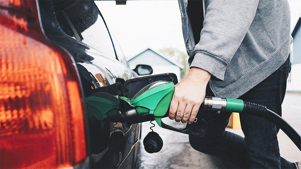 Man filling fuel tank