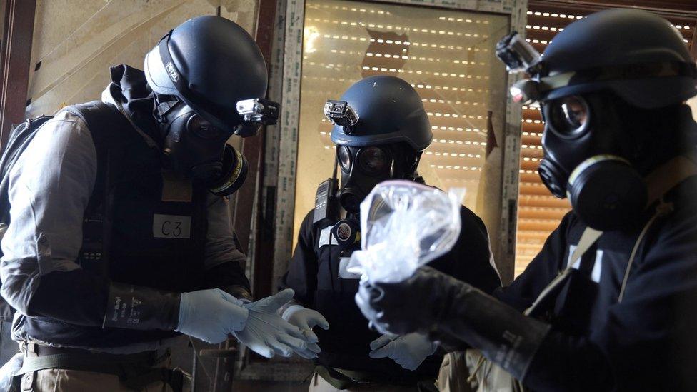 Chemical weapons experts collect samples from the site of an attack in Ain Tarma, Damascus, on 29 August 2013