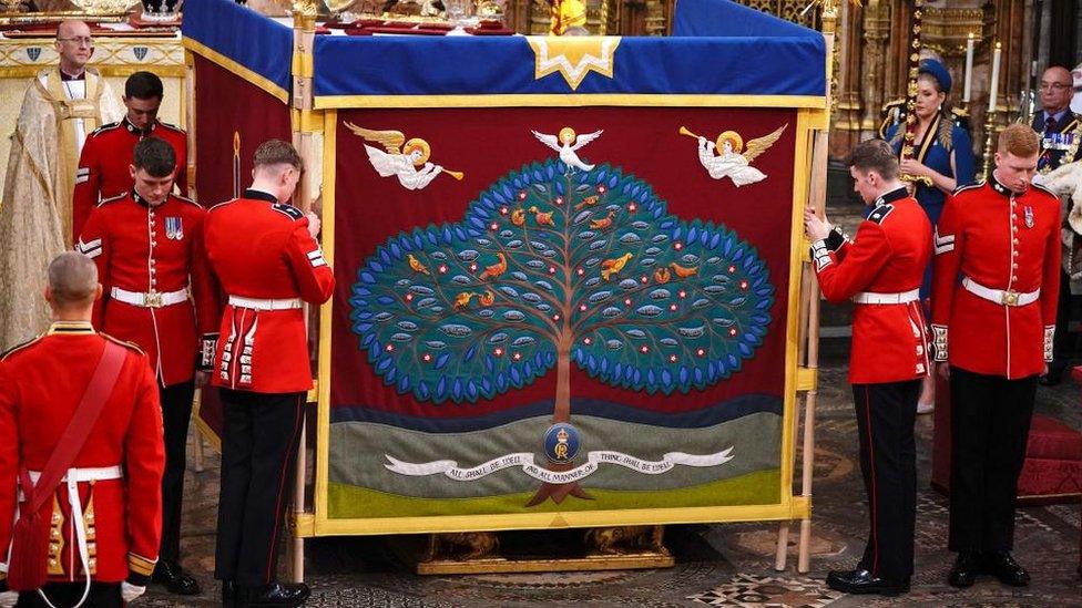 Screens were held up by soldiers while the King was anointed with holy oil