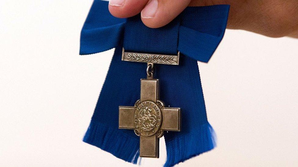 A George Cross medal, awarded to French-born British World War II agent Violette Szabo, is displayed for a photograph before being sold at action for in London on 22 July 2015.