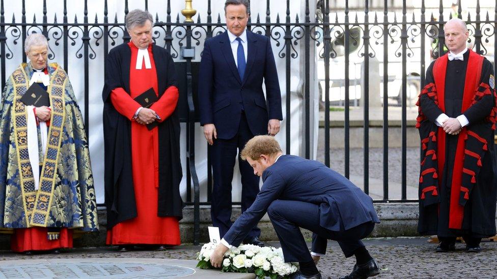 Prince Harry laid a wreath at Westminster Abbey's memorial to innocent victims, with the prime minister looking on