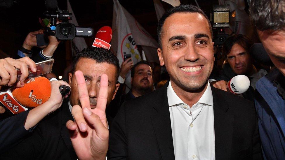 Italian Deputy Prime Minister Luigi Di Maio celebrates outside Chigi Palace at the end of the Council of Ministers