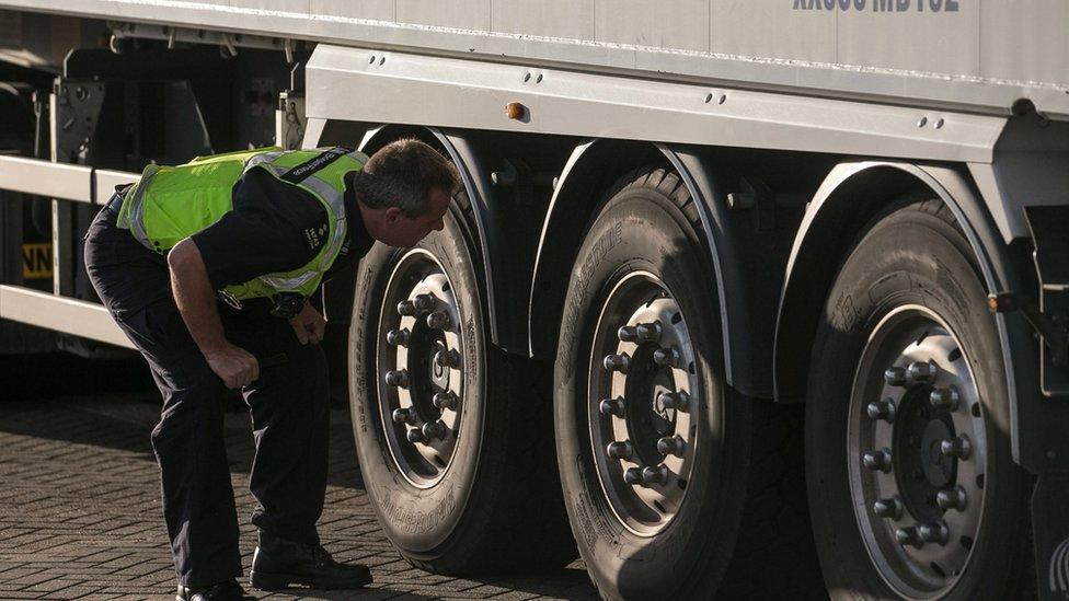 Border Force staff check lorries and trucks arriving at the UK border as they leave a cross-Channel ferry in Portsmouth, England.