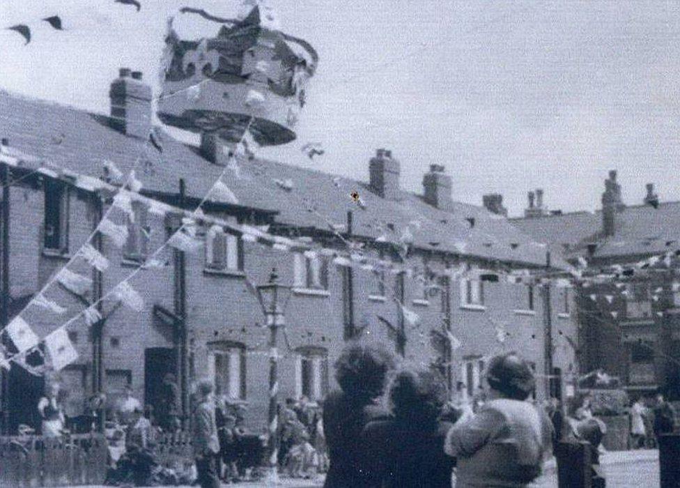 Giant crown on rooftop in 1953