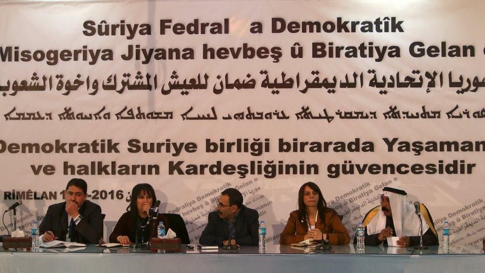 Syrian Kurdish representatives attend a conference in Rmeilan on 16 March 2016