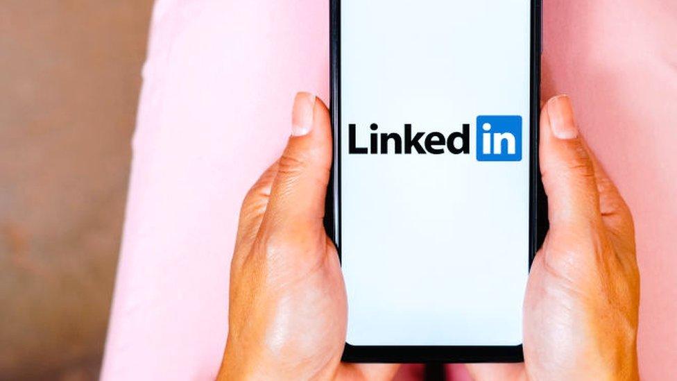 A mobile phone with the LinkedIN logo on it