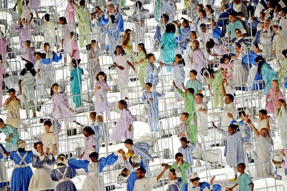 Performers pay tribute to the National Health Service during the Opening Ceremony of the London 2012 Olympic Games