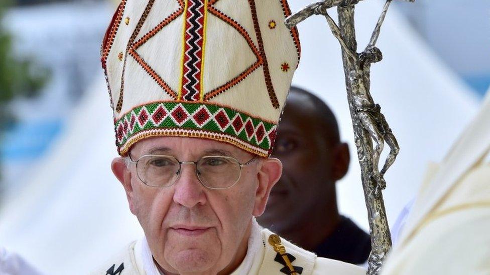 Pope Francis arrives to celebrate a giant open-air mass at the University of Nairobi on November 26, 2015