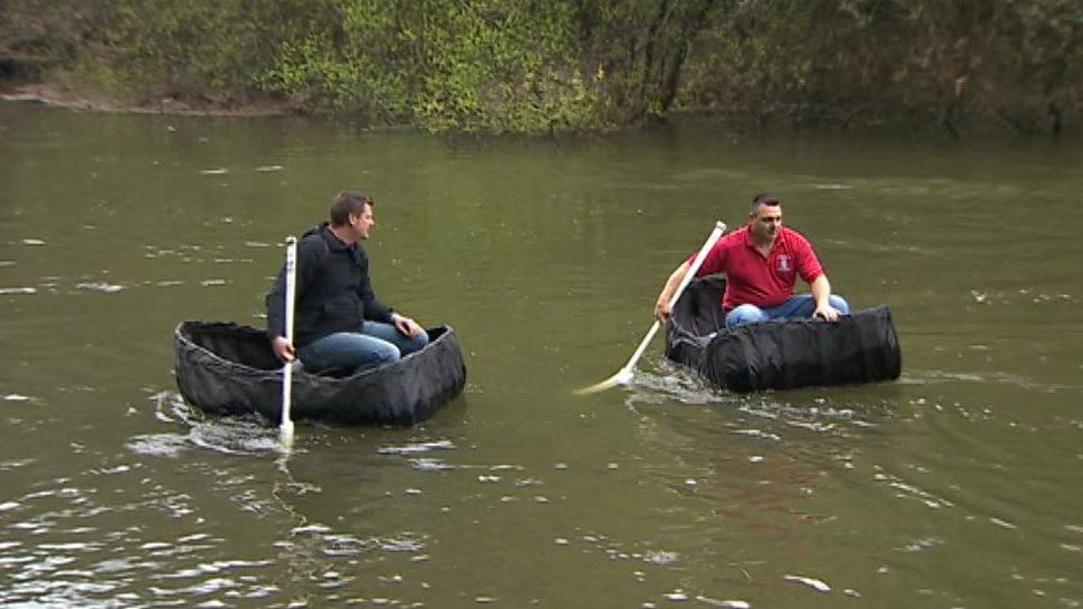 Fishermen catch sea trout in their traditional coracle boats on the River Teifi