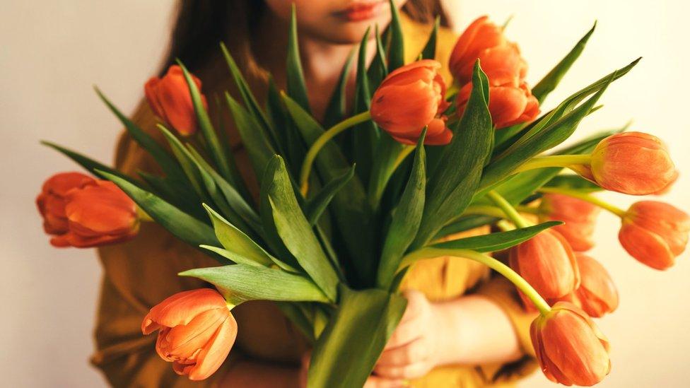 A child with flowers