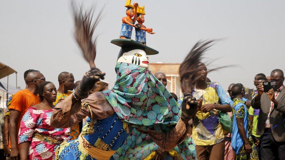 A masquerade dancer at the annual voodoo festival in Ouidah