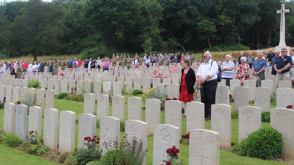 People pay their respects to the Welsh soldiers who fell at Mametz Wood in Flatiron Copse cemetery