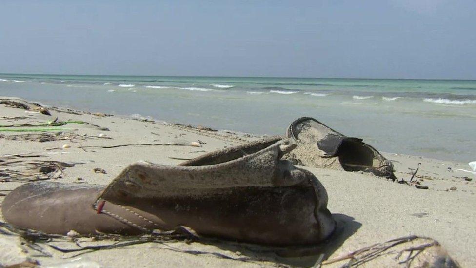 Migrants' belongings on the beach at Zuwara