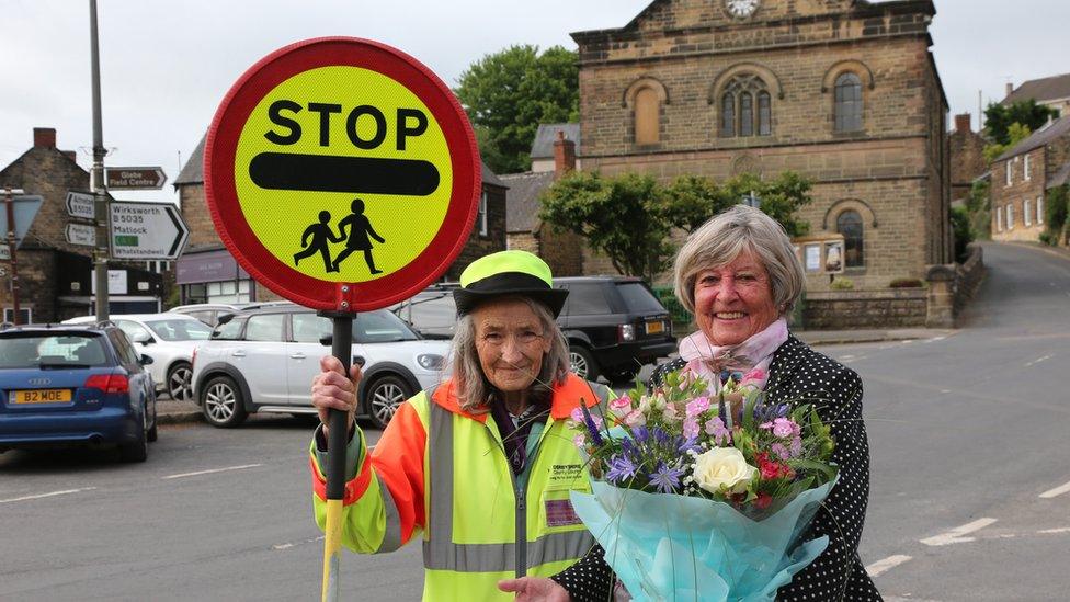 Suzanne Wetton receives flowers from councillor, Carol Heart