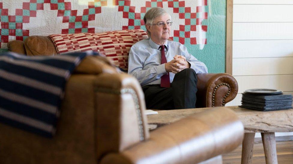 Mark Drakeford sat on a sofa