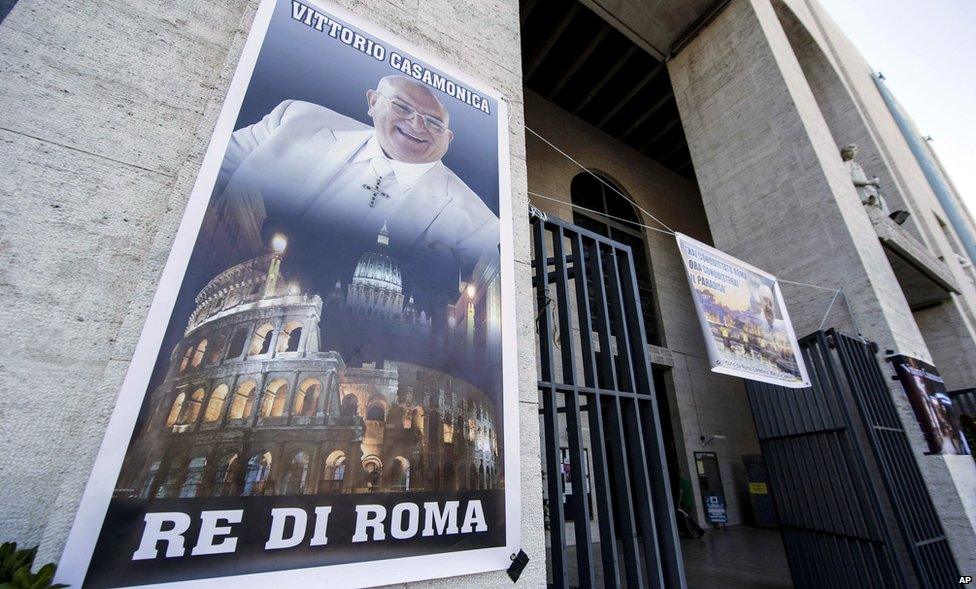 A banner showing purported mafia boss Vittorio Casamonica and reading "King of Rome" hangs from the facade of the Don Bosco church in Rome, Thursday, 20 August 2015.