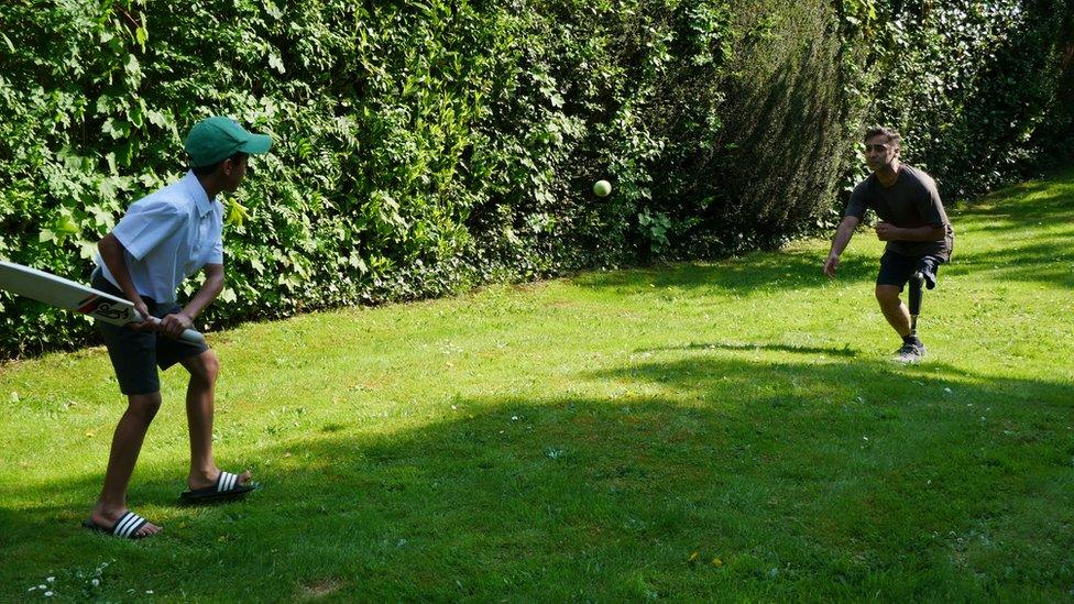 Mohsan playing cricket with his son