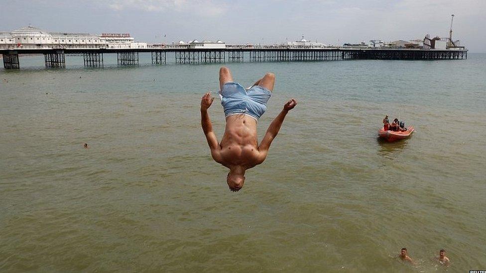 Man jumping into the sea in Brighton