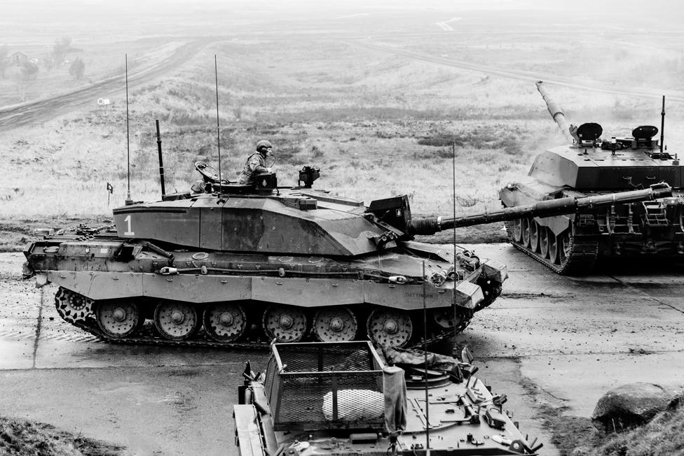 Challenger 2 tanks of D Squadron, The Queen's Royal Hussars getting into position for a live firing battle run on Bergen-Hohne training area in northern Germany