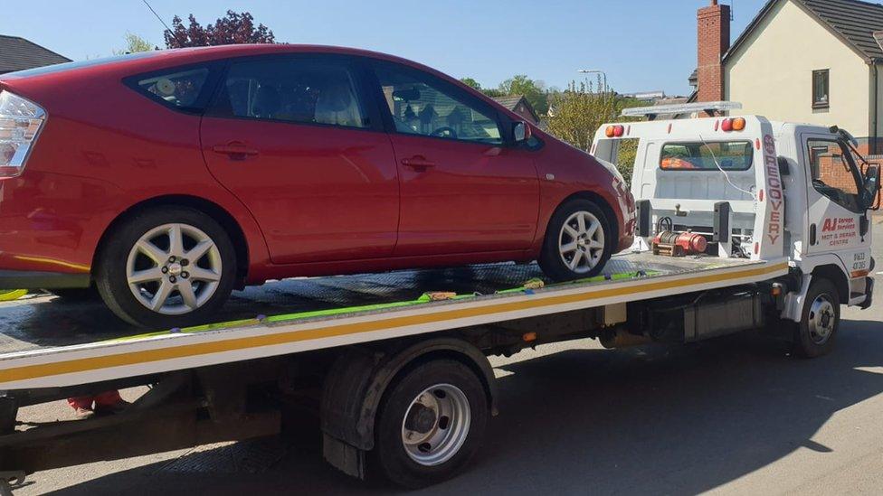 Car on the back of a rescue lorry