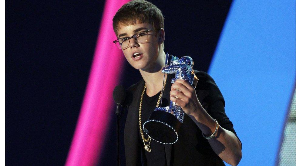 Justin Bieber with an award