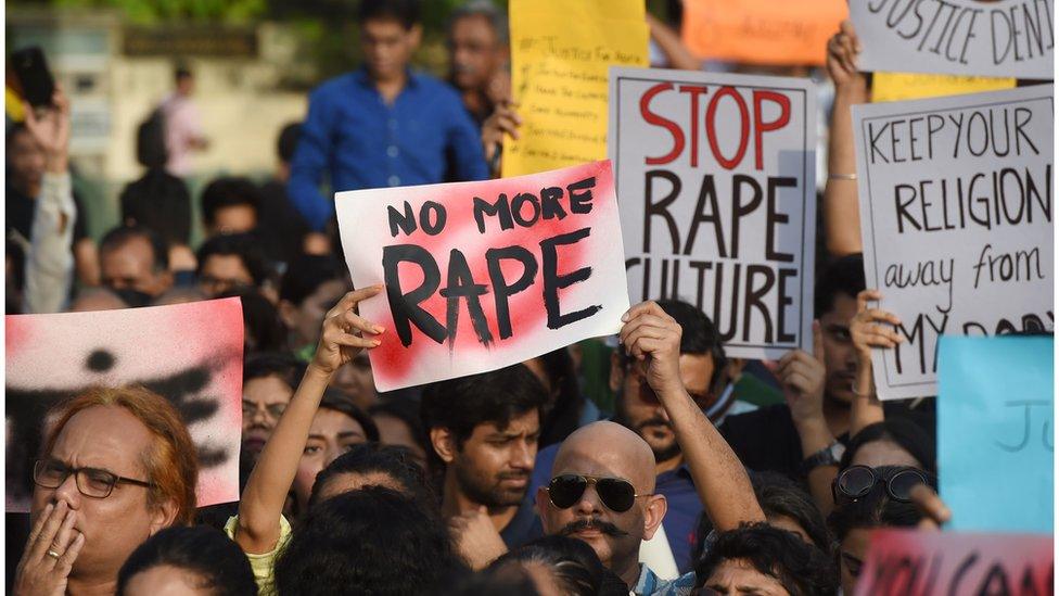 Indian demonstrators hold placards during a protest in support of rape victims following high profile cases in Jammu and Kashmir and Uttar Pradesh states, in Mumbai on April 15, 2018.