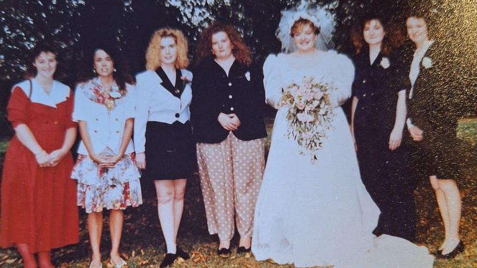 Sarah Jane Clark pictured with a bride at a wedding