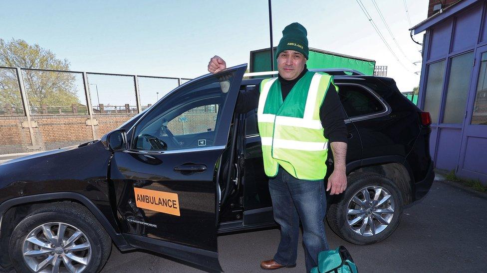 Jonathan Ganesh with donated support ambulance