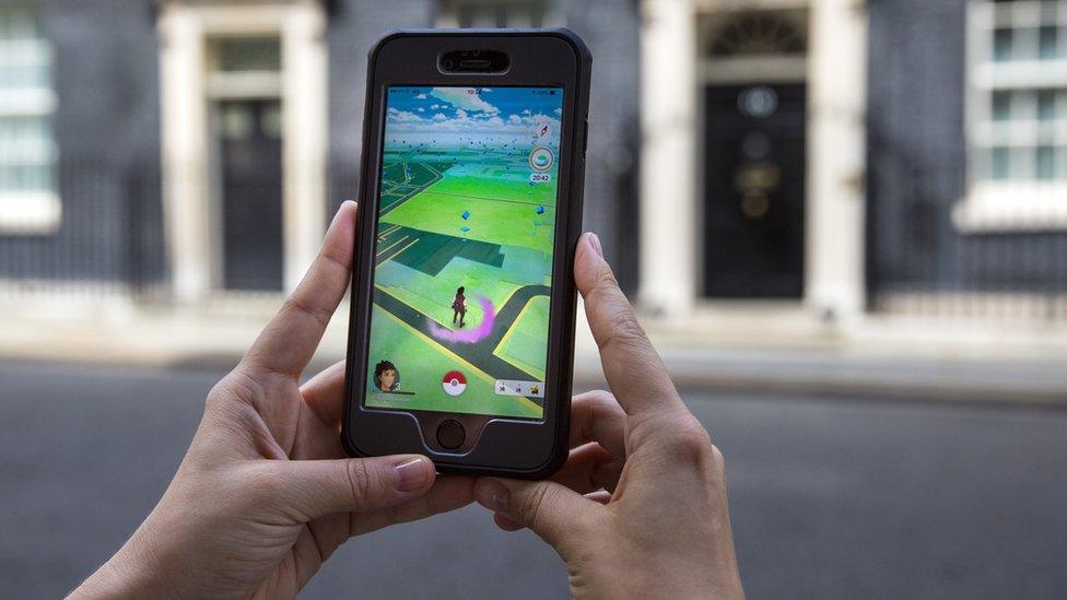 A phone with Pokemon Go on the screen