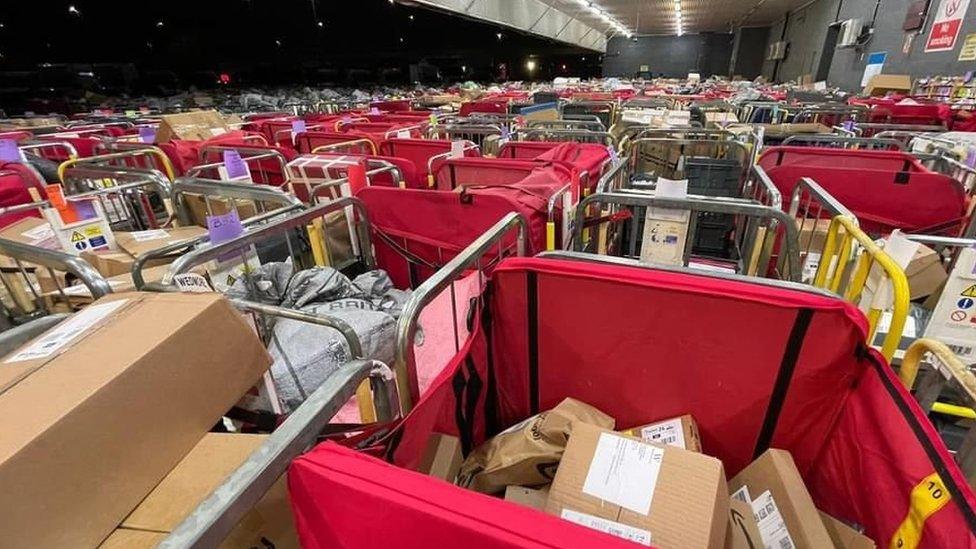 Cages of letters and parcels at the Bristol Mail Centre