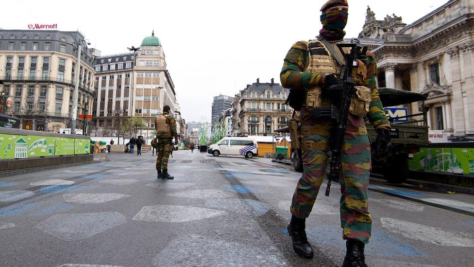 Soldiers stood guard on Tuesday in the normally busy Rue du Midi (24 Nov)