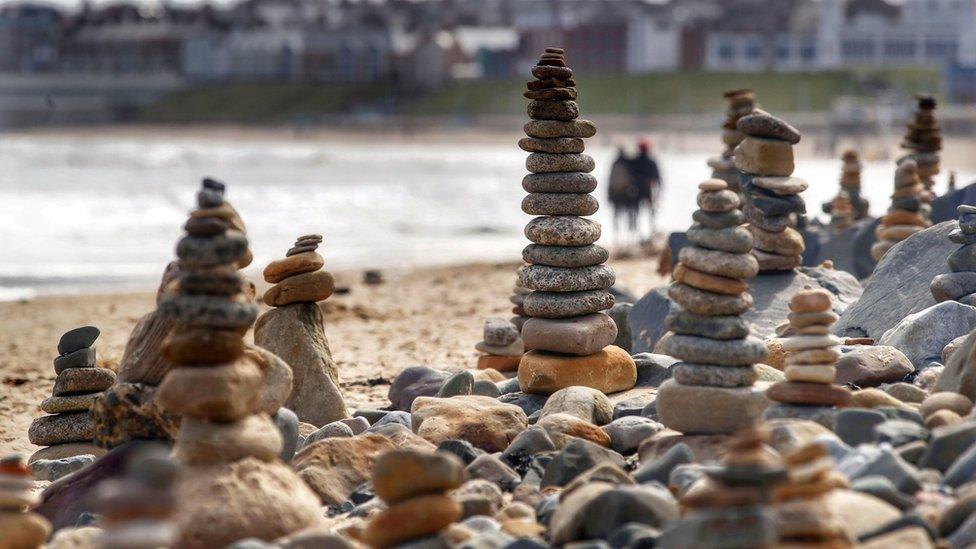 Pebble stacks on beach