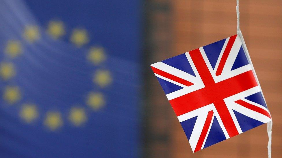 A small British flag is seen flying outside the European Commission headquarters in Brussels, Belgium, with the EU symbol in the background (1 June 2016)